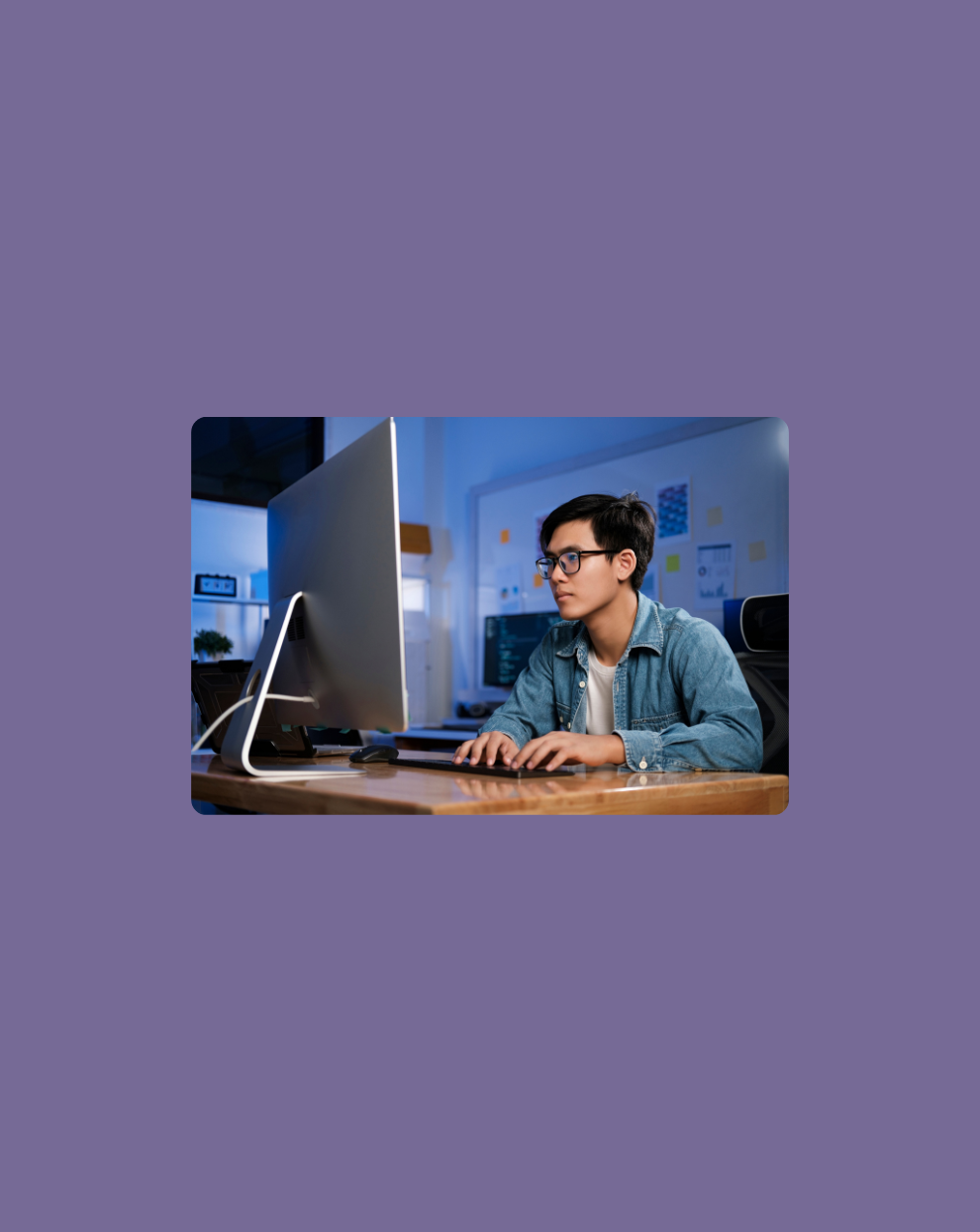 Image of a developer coding on his iMac and building an AI Agent on the AgenticFirst platform